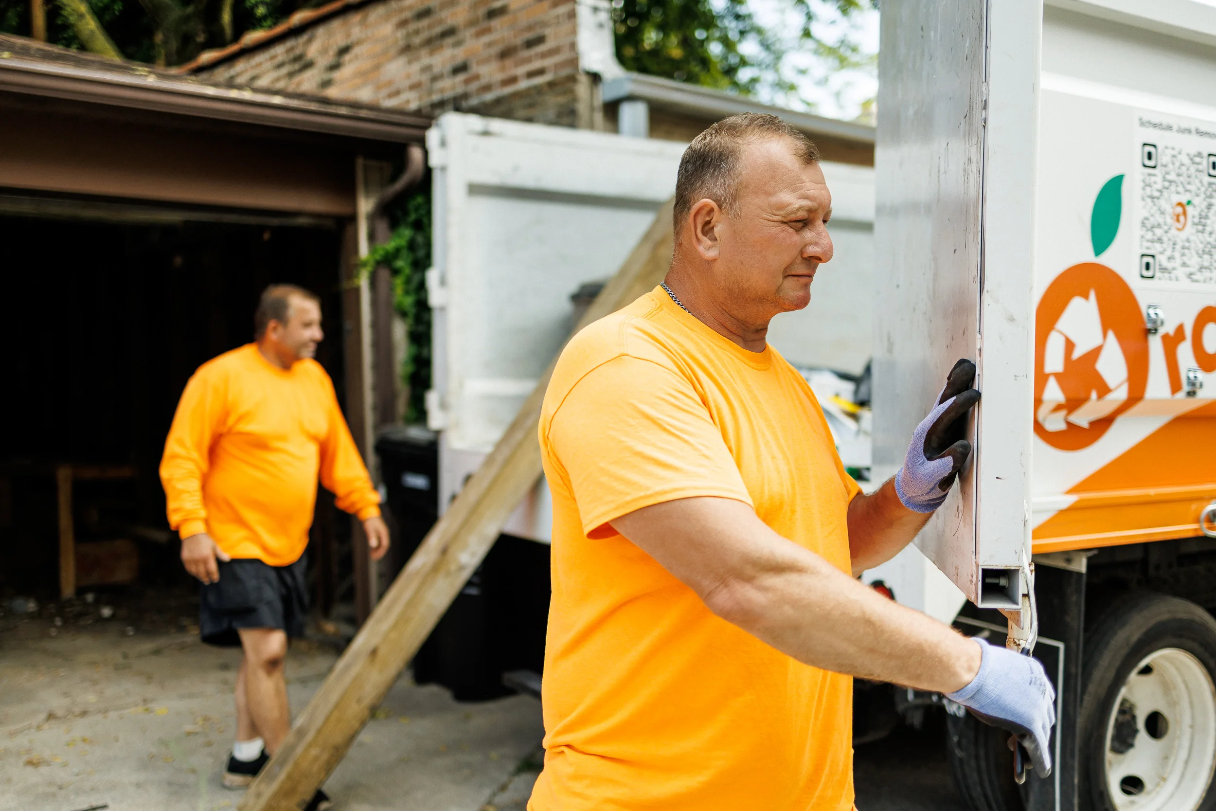 Orange Crew haulers clearing a Chicago home during a full estate cleanout